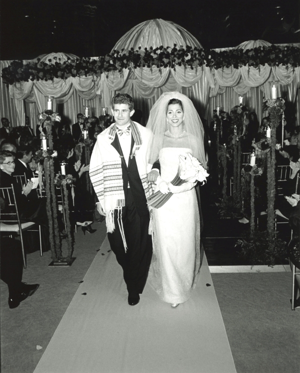 Couple in former wedding attire