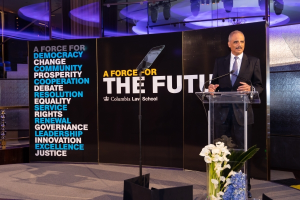 Eric Holder at podium at Law School celebration