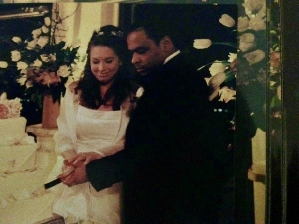 Anne Voigts and Troy Foster cutting wedding cake