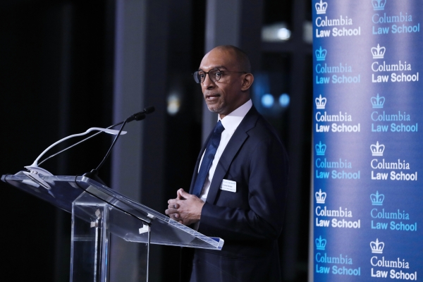 Dean Daniel Abebe at podium