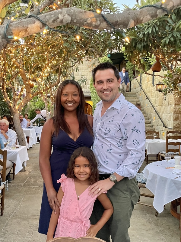 Samanatha and Zac Soto with their daughter, Violet, at an outdoor restaurant