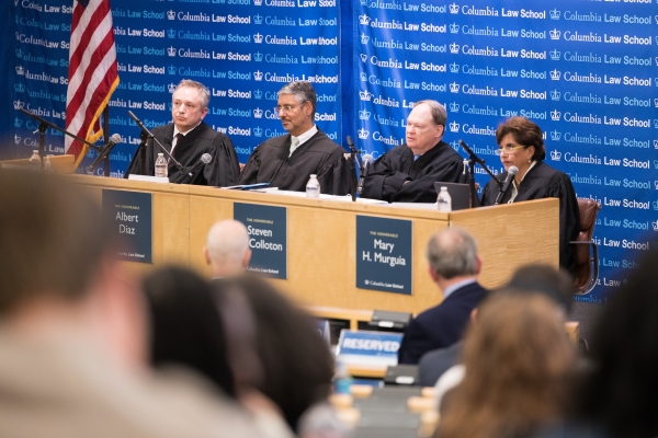 The four judges of the 2026 Harlan Fiske Stone Moot Court Competition hearing student arguments at Columbia Law School.