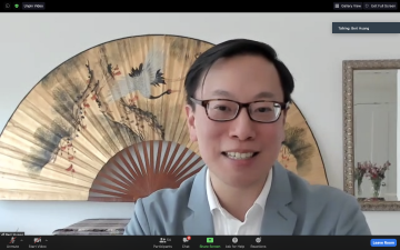 Video screengrab shows man speaking with a golden fan in background