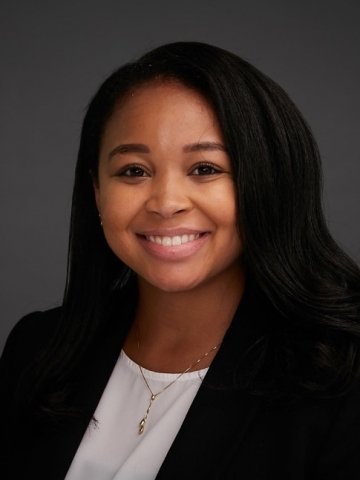 Columbia Law student Kiara Rogers in white blouse and dark jacket