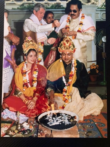 Valérie Demont ’95 LL.M and Bal Das ’95 LL.M. sitting on the floor wearing traditional Indian clothes 