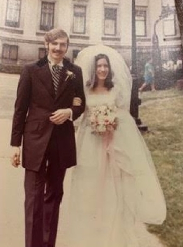 bride and groom in formal attired on Columbia University campus