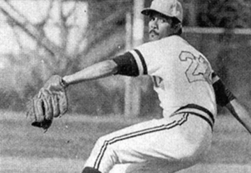 Black and white photo of baseball pitcher rearing back to throw