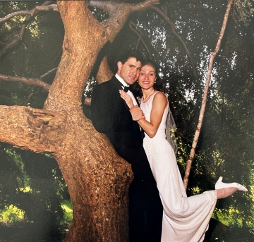 Jen and Jared Levin in a tree at their wedding