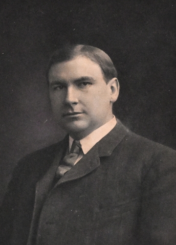 Black and white portrait of Harlan Fiske Stone in jacket and tie
