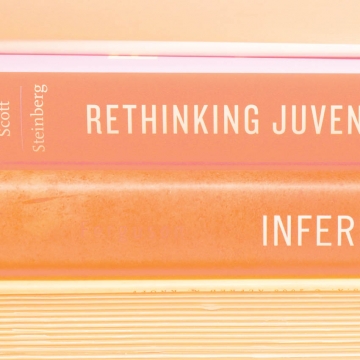 A stack of the spines of several faculty books.